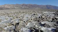 38-Devil's_Golf_Course_salt_formations_with_water_along_West_Side_Rd-widescreen