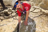 31-Kenny_checking_out_how_deep_the_desert_crack_is-it_is_deep