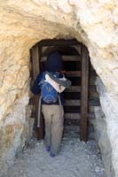 42-Kenny_checking_out_the_sealed_mine-he_has_Junior_Ranger_program_in_his_pack