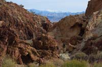 46-zoom_of_pretty_colorful_terrain_with_snowy_Spring_Mountains_in_distance
