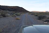 02-good_dirt_road_requiring_2WD_high_clearance-passing_by_volcanic_mound