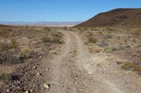 03-one_of_several_small_drainage_ditches_on_dirt_road_requiring_clearance