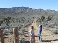 03-Kenny_and_Sierra_at_trailhead_pointing_to_where_we_are_going-from_Joel