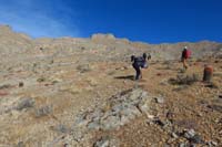 15-continiuing_along_ridge,fossils_on_ground,prospect_mine_to_left_in_distance