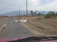 02-this_road_was_closed_for_an_hour_yesterday_because_3_feet_of_water_was_flowing_across_in_area