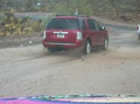 54-lots_of_people_going_through_flooded_area