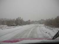 77-snow_covered_dirt_road-over_a_dozen_rental_and_private_vehicles_drove_up_here_while_I_was_leaving