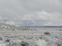 10-pretty_view_of_Grand_Canyon_peaking_out_of_clouds_with_good_dusting_of_snow