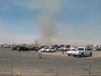 05-view_from_main_terminal-saw_helicopter_with_water_bucket_being_used_to_put_out_fire