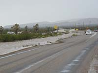 12-Stockton_Hill_Rd_and_Pierce_Ferry_Rd-river_flowing_on_side_of_road