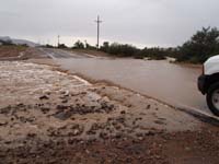 19-215pm-flooded_road,but_not_too_bad-road_closed-our_truck_could_have_made_it_across_without_a_problem