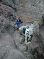 06-Joel_carrying_Toby_down_a_boulder_Kristi_just_climbed