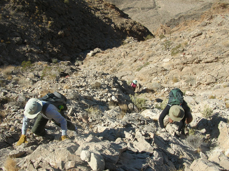 07-Dad_climbing_up_a_wash