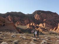 04-group_and_sunrise_views_of_sandstone-Sentinel_Peak_is_top_of_limestone_layer_thrusted_over_the_sandstone