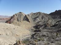 12-Ali_and_views_of_where_we_hiked-limestone_eroded_over_time_to_produce_normal_desert_ground