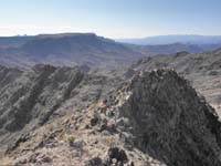 20-following_ridgeline_with_Malpais_Flattop_Mesa_in_background