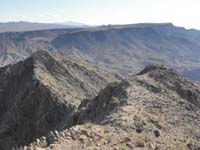 51-scenic_view_from_Willow_Beach_Peak_to_Kenny_Peak_and_Malpais_Flattop_Mesa-SSE