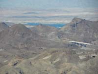23-view_from_Peanut_Peak-zoomed_view_of_Lake_Mead-Sugarloaf_Mt-a_bridge_for_Hoover_Dam_bypass