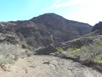 07-hiking_up_wash_towards_peak,although_basically_a_ramp_on_backside