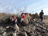 06-kids_having_fun_playing_with_the_rocks