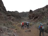 01-Ed,Laszlo,Luba_hiking_down_Gold_Strike_Canyon-hike_because_unseasonably_cool_for_early_April