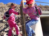 03-Kenny's_picture-Sarah_climbing_through_the_fence