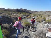 05-Kenny_leading_the_way_down_the_wash_to_Peanut_Peak_in_distance