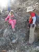 59-Lexi_climbing_down_small_dry_waterfall-Kenny_is_supposed_to_be_helping_her_down-no_need_though