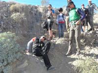 03-Sue_climbing_under_the_fence