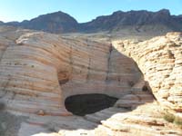 12-watering_hole_inside_sandstone_lump-our_saddle_in_distance,then_to_left