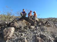 06-Ally,Shaler,and_Kenny_taking_a_break_on_a_mound-breaking_some_pieces_off_too