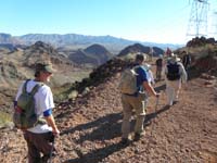 07-group_on_old_powerline_road_on_ridge_toward_peak