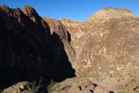 019-looking_NW_to_left_of_prior_picture-big_cliff_in_shadow-I_explored_up_drainage_later_in_hike