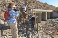 02-climbing_around_fence_to_get_to_hike_down_wash