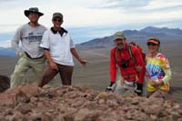 23-summit_photo_with_Wilson_Ridge_S_Flattop_between_me,Laszlo,Ed,Luba