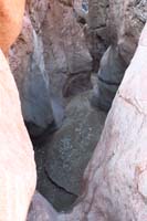 05-we_encounter_a_slot_canyon_with_dry_waterfall_drop,no_rap_equipment_so_need_to_go_around