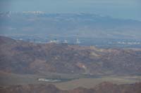 09-zoom_view_of_Mt_Charleston_with_snow,portion_of_northern_Strip,downtown,River_Mts,Lake_Mead_trailer_park