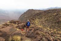 09-Laszlo_admiring_another_vibrant_barrel_cactus_as_we_continue_to_the_break_in_the_cliff