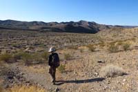 01-Kenny_heading_to_the_main_wash_with_Peanut_Peak_in_distance