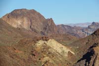 12-zoom_view_looking_north_to_Lizardback,Head,Horn_Peaks-Hoover_Dam_bypass_bridge