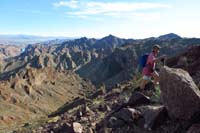 65-Laszlo_hiking_up_steep_terrain_with_amazing_views_in_background