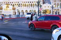 24-people_waiting_to_cross_street_in_front_of_Venetian,some_wearing_masks,some_not