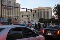 094-crowds_of_people_crossing_the_street_while_others_watching_the_Bellagio_fountains