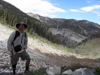 37-me_at_cliff_with_snowpack_and_mountain_views