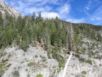 13-going_this_direction_on_the_way_to_Mt_Charleston_at_top_beyond_the_trees