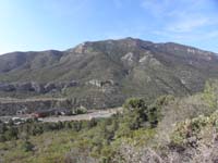 16-view_from_Hwy_158_looking_down_on_Resort_on_Mt_Charleston_and_Harris_Peak