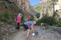 09-Susan_trying_to_remove_more_graffiti_along_the_trail