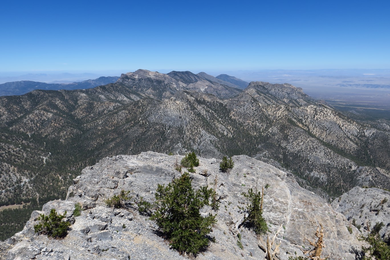 31-scenic_view_from_peak-looking_NW-McFarland,Bonanza,Sisters,Macks_Peaks