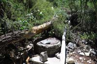 33-manhole_at_end_of_heavily_used_old_road_leading_to_Cathedral_Rock-audible_flowing_water