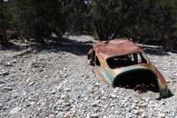 55-Blue_Tree_car_covered_by_a_couple_feet_of_debris,trail_not_well_defined